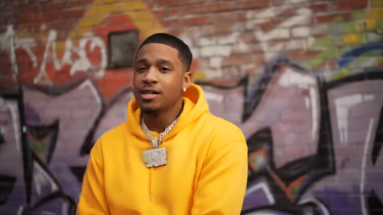 A man raps to the camera